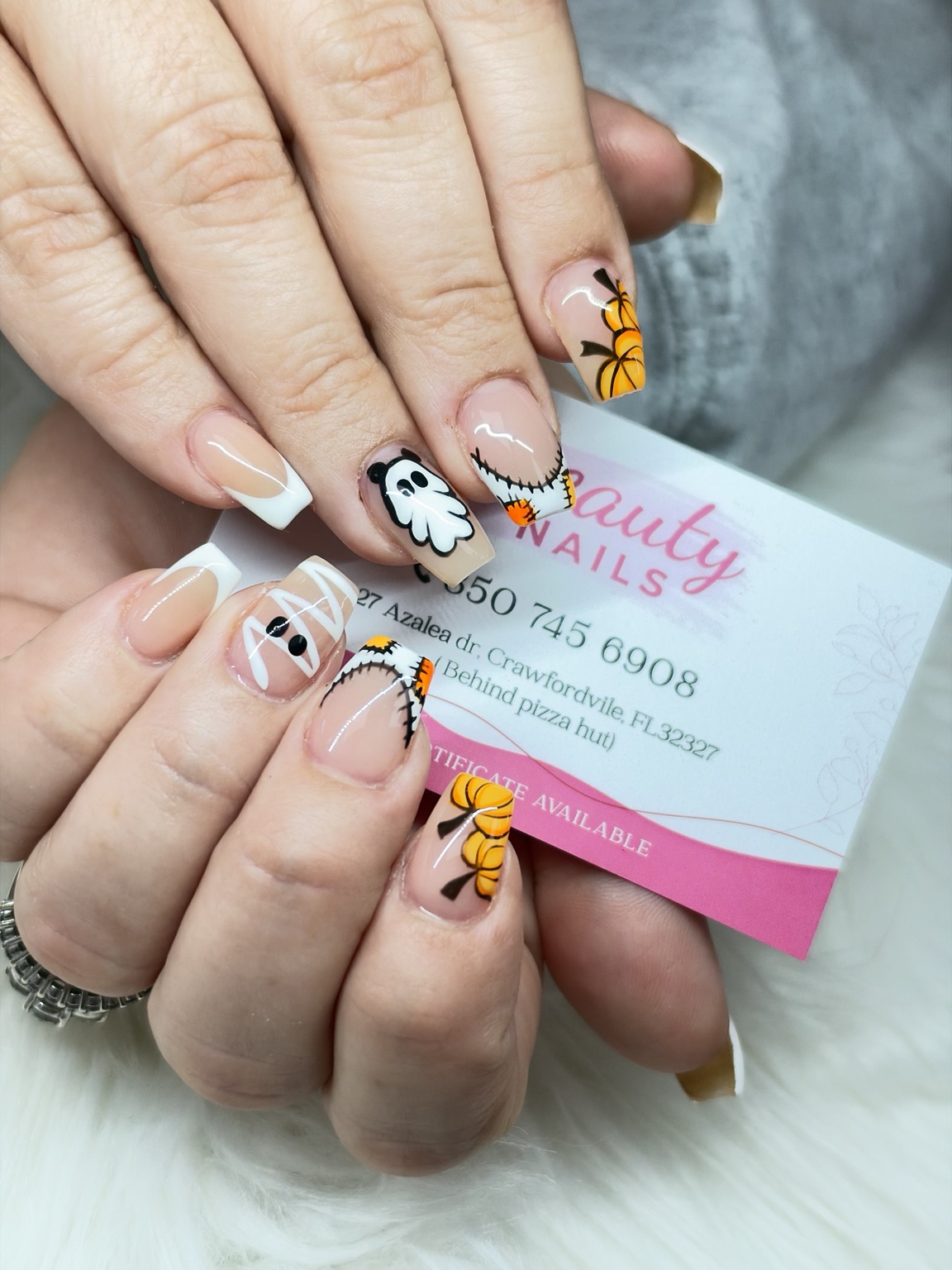 Halloween nail design with pumpkins, ghost and French tips